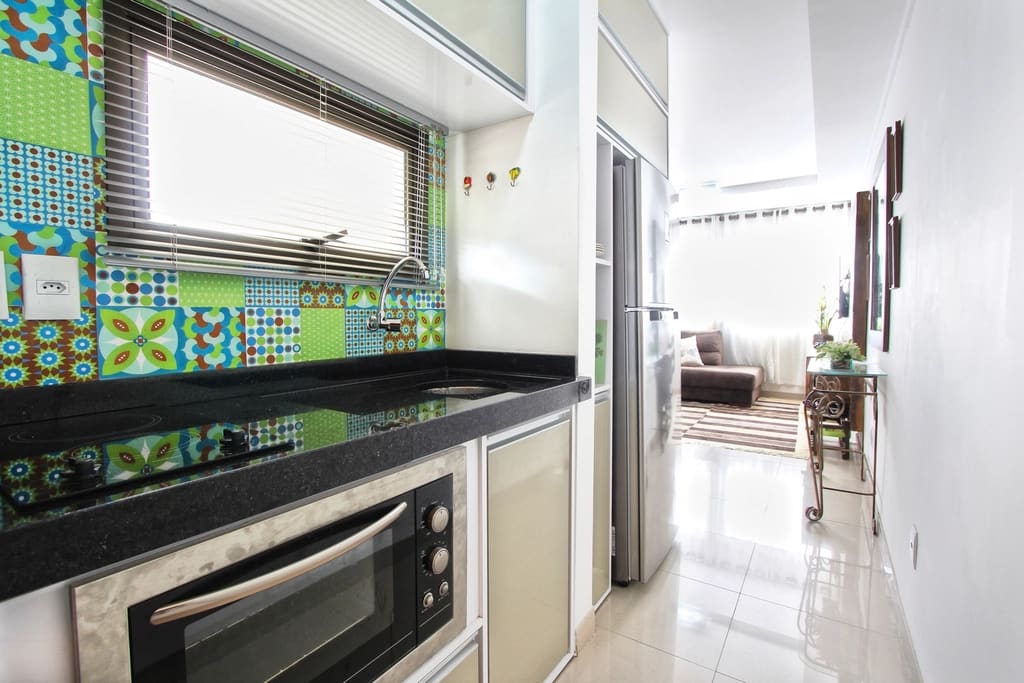 Photograph of a modern kitchen interior with counter space and appliances